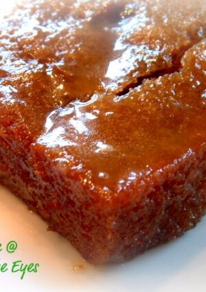 A slice of spice cake with a glazed frosting