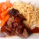 This Red Wine Braised Beef Brisket is a budget-friendly recipe by braising an inexpensive cut of brisket in red wine and herbs. The meat was very tender and the gravy was super flavorful. We served this with buttered noodles and glazed carrots.