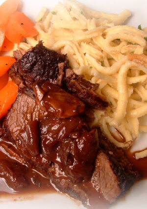 This Red Wine Braised Beef Brisket is a budget-friendly recipe by braising an inexpensive cut of brisket in red wine and herbs. The meat was very tender and the gravy was super flavorful. We served this with buttered noodles and glazed carrots.