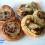 These Savory Palmiers are very simple h'ors doevres that can be made ahead, or just a few minutes before taking them into hot and flavorful appetizers. Puffy pastry is so easy to work with. This recipe is versatile, where you can interchange the kind of cheese you prefer to use. This version has basil pesto, sun-dried tomatoes and feta cheese-- or you can use goat cheese.
