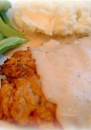 Chicken Fried Steak with gravy served with mashed potatoes