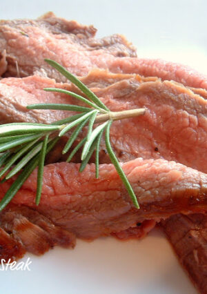 This Grilled Flank Steak is marinated with garlic, shallot and rosemary. This a very quick and easy rub that comes together really fast! You'll need a mini-chopper or blender, for a one hour marinade. This recipe is perfect for a gas grill or charcoal grill. The steak has so much flavor. Just remember to slice the steak against the grain and very thin!