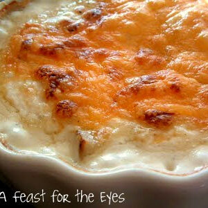 This easy Creamy and Cheesy Potato au Gratin casserole is loaded with creamy, garlicky and cheesy goodness. It's a perfect side dish with any meal, but we particularly love it as a side dish to any barbecue dinner..