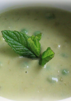 Fresh English Pea Soup is creamy and so comforting. Unlike split pea soup (made with dried peas), fresh shelled peas are the star of this recipe. A small amount of heavy cream gives this soup a silky flavor. A little Parmesan cheese, adds another layer of flavor. For added texture, whole peas are added, some garden tarragon and then a little bit of fresh lemon juice, rounds out the flavor of the soup with some spring brightness.