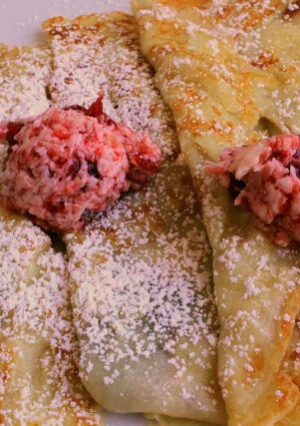 Swedish Pancakes with Lingonberry Butter are delicate, buttery, tangy, and delicious... are just a few adjectives that describes how good these are. Lingonberries are the authentic jam to use for this recipe, and they have become more readily available in supermarkets. You can serve these with plain jam, but I decided to add the jam to whipped butter which gave these extra richness.