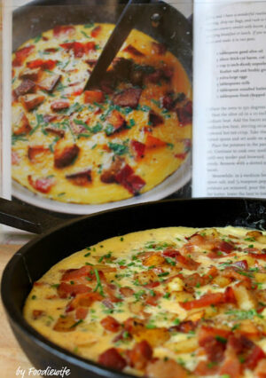 An omelet with bacon and potatoes