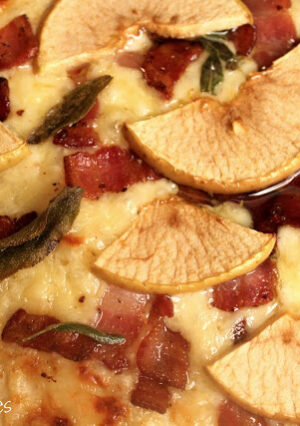 This Gourmet Apple and Cheese Pizza and a Whole Wheat Crust is one of the most delicious pizzas I have ever made! The combination of apples, bacon, caramelized onion, Gouda and Sage is perfection. The Whole Wheat crust is very easy to make and to work with. A light layer of olive oil replaced a more traditional red pizza sauce. This is "gourmet pizza" at it's finest. Once you sink your teeth into a slice of this pizza, you'll love it as much as we do!