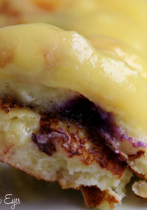These Lemon-Blueberry Ricotta Pancakes are moist and tender. We particularly love them with homemade lemon curd. If you’ve never made lemon curd, this recipe is super easy to make. The batter takes abut 15 minutes to prepare, as does the curd. That’s what I call fast food breakfast! You can leave out the lemon and berries, and serve these plain with maple syrup. If you’ve never tried ricotta pancakes, I’m confident you’ll make them more than once. We do!