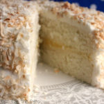 This Coconut Cake ended up with exactly what I was hoping for! I wanted a white coconut cake, that would be moist and would have a perfect balance of coconut. I used coconut milk powder, coconut flavor and buttermilk. The middle of the cake was filled with lemon curd. The frosting is made with buttercream, coconut creme, and a balance of almond, vanilla and coconut extract. Coconut flakes were toasted, and then pressed onto the cake. At last, I created a cake recipe that was tender and moist. The balance of the lemon curd was perfect with the sweetness of the buttercream frosting. Success!