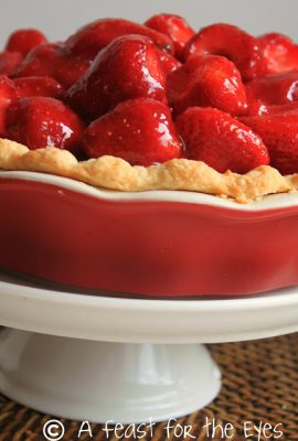 This Strawberry Pie features fresh, uncooked, strawberries. The pie is finished with a homemade glaze, made with pureed strawberries. The glaze highlights the sweetness of the berries. The pie crust is tender and buttery-- and has a secret ingredient that makes this the perfect pie crust.