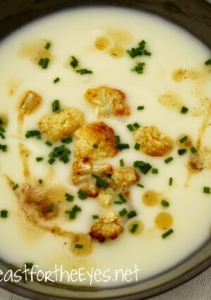 A bowl of cauliflower soup with cauliflower croutons
