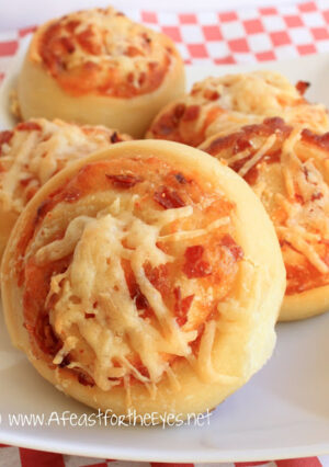 Pizza Wheels (aka Party Pizza Buns) are a fun hand held pizza that are fun to make. These aren’t difficult to make, and they are terrific for a party or just a hand-held snack. The dough isn't terribly difficult to make. Pepperoni pizza rules in our home, but these are adaptable to any of your favorite fillings.