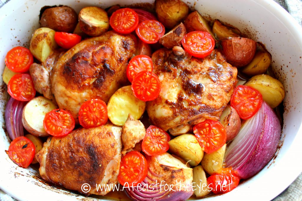 Quick dinners that don't require a lot of prep work and let's the oven do the majority of the work (except clean up) and delivers on lots of flavor is what this recipe is all about.  While this dinner is roasting, the aromas are enough to get your appetite going.  The chicken is super tender, with a flavorful paprika sauce, garlic, potatoes and roasted tomatoes that is a flavor explosion on your taste buds.   This is a simple weeknight dinner but fancy enough to impress dinner guests.