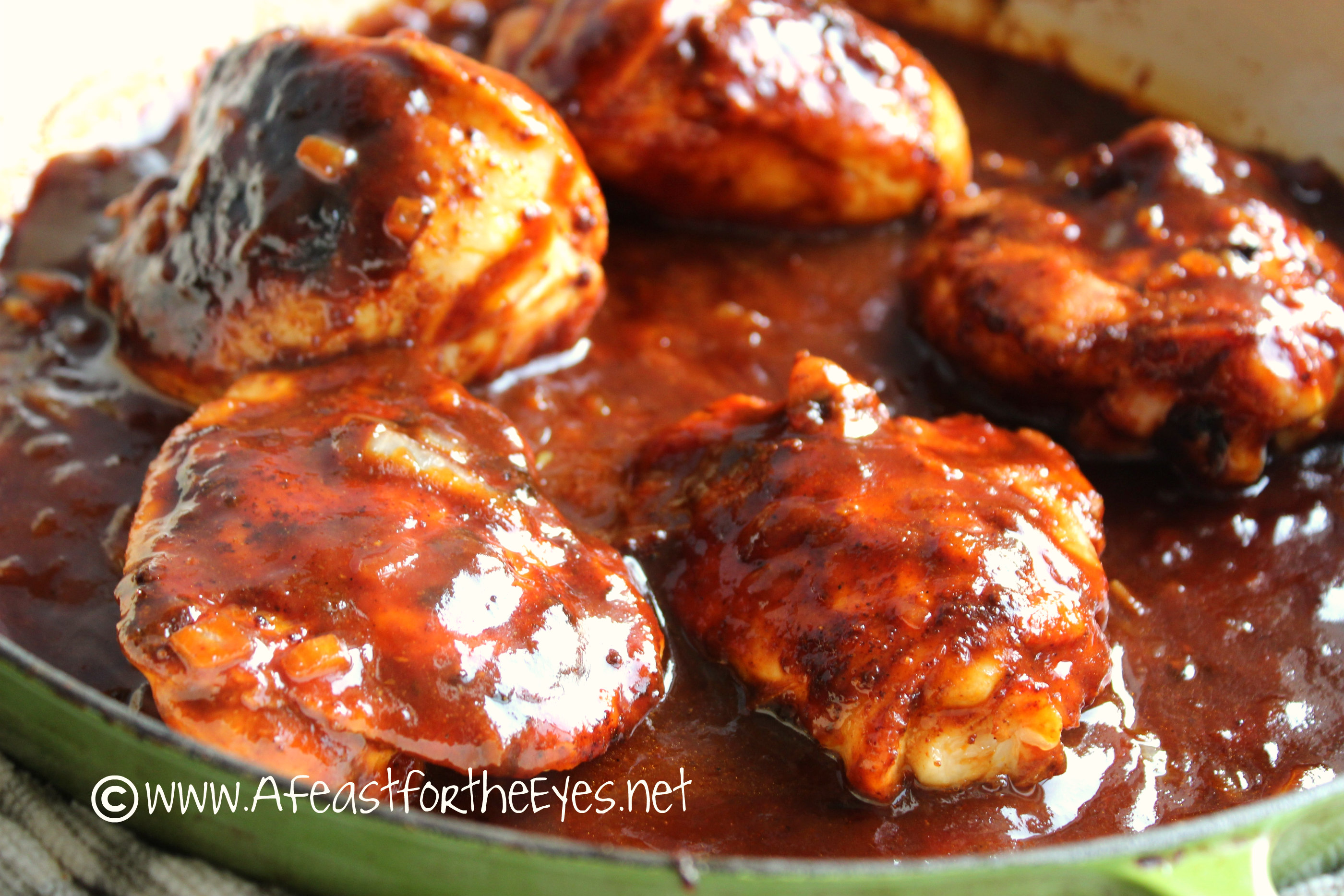This Indoor Barbecue Chicken recipe really knocked our socks off-- from the juicy chicken to the quick homemade tangy barbecue sauce that was rich in flavor.  Best of all, the prep work wasn't uber time-consuming. A quick spice rub (with no weird ingredients) took a couple of minutes to mix together. The chicken is easily seared by placing into a screaming hot cast-iron skillet until roasted to perfection. As for the homemade barbecue sauce-- wow!  Just a few pantry ingredients, and it had a beautiful rich red color with a sweet and tangry finish to it. The sauce is good enough to bottle for so many uses! This is almost a "one-pan" dinner so this is a perfect week night meal to put together.  I am so making this again!