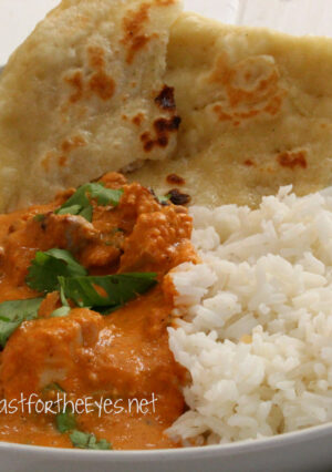 Butter Chicken is a Northern Indian dish, and a close cousin to Tikka Masala. The sauce is a rich and creamy tomato base with aromatics that include garam masala, ginger and a few other spices. Chicken thighs are coated in yogurt that, when broiled, mimics the char flavor of a traditional tandoori oven. Served with rice or warm naan (bread), this is a flavorful meal. As for heat? The serrano chili adds a touch of heat, but doesn't turn you into a fire breathing dragon! I can't rave enough about how much we loved this recipe. If you love Indian food, then this is the recipe for you!