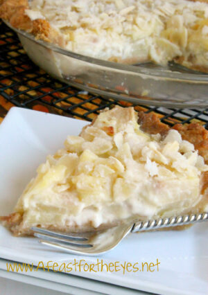Apple pie is an all American iconic favorite. This French Apple-Custard Pie kicks it up a few notches by adding a creamy vanilla custard to sautéed apples, then topping it with a crunchy almond streusel. This makes an elegant dessert, perfect for a holiday dessert table.