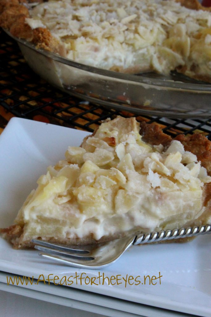 Apple pie is an all American iconic favorite. This French Apple-Custard Pie kicks it up a few notches by adding a creamy vanilla custard to sautéed apples, then topping it with a crunchy almond streusel.  This makes an elegant dessert, perfect for a holiday dessert table.