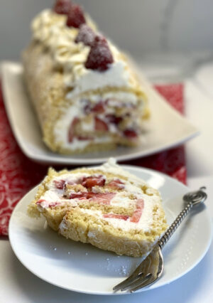 Slice of strawberry swiss roll.