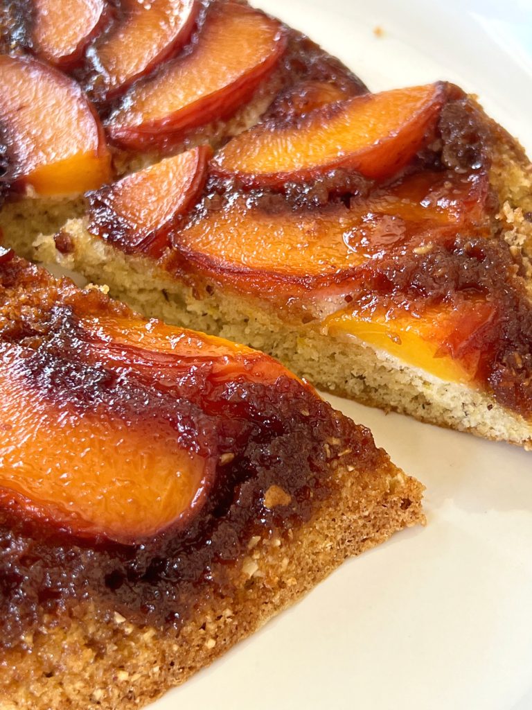 This Peach Upside Cake showcases sweet summer peaches in a delicious way. (Yes, you can use thawed, frozen peaches in the off-season.) The cake has added flavor and structure by adding ground almonds to the batter. Peach slices are layered over an easy-to-make caramel. Once baked, the cake is inverted to reveal a show-stopping beautiful peach cake that will impress anyone!
