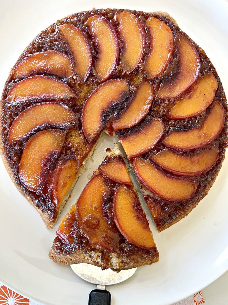 This Peach Upside Cake showcases sweet summer peaches in a delicious way. (Yes, you can use thawed, frozen peaches in the off-season.) The cake has added flavor and structure by adding ground almonds to the batter. Peach slices are layered over an easy-to-make caramel. Once baked, the cake is inverted to reveal a show-stopping beautiful peach cake that will impress anyone!