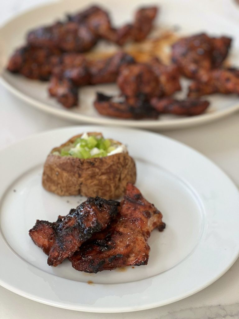 Country-Style ribs are both inexpensive and flavorful.  With this recipe, you make a simple dry rub, and use half of that rub to make a quick no-cook barbecue sauce. There's a short brine involved, so that the pork grills nice and juicy.  Super simple, super delicious!