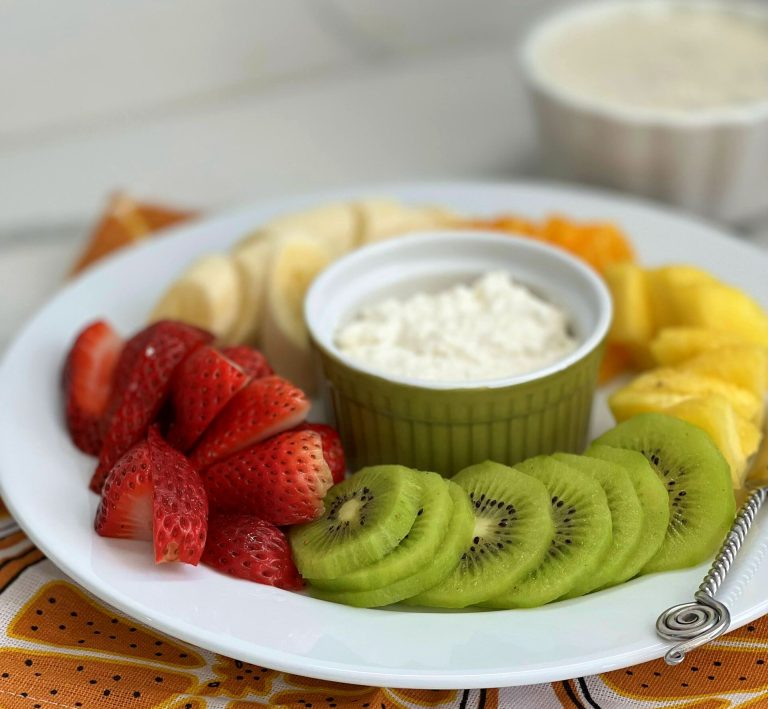 Fresh sliced fruit looks so pretty when it's "shingled" on a plate-- almost like a rainbow! I made a creamy cottage and low-fat cream cheese dip. To guild the lily, I made a banana sauce with yogurt and honey. It's a delicious fruit dip that complements the fresh fruit perfectly.