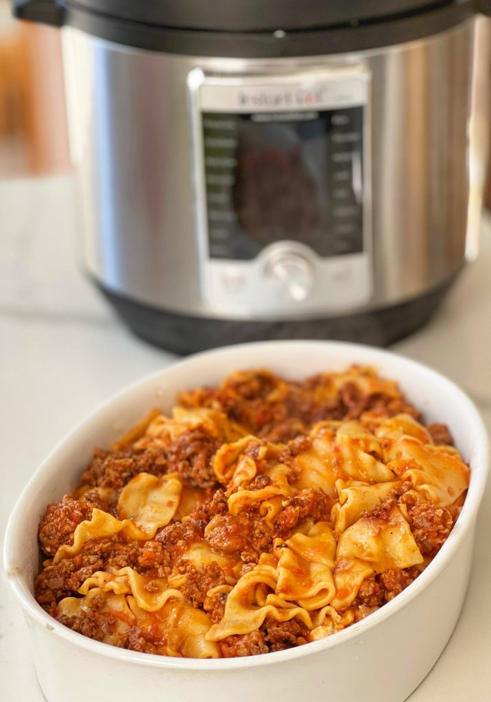 This recipe is perfect for a busy cook. It takes 15 minutes of prep work to brown ground beef and sausage and to add some seasoning. Toss some lasagna noodles into the pot, pasta sauce and 5 minutes of pressure cooking. Add some ricotta cheese and Mozzarella, and dinner is ready in 30 minutes or less!