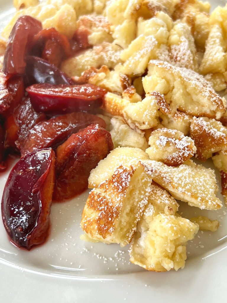 Kaiserschmarrn or Kaiserschmarren is an Austrian shredded pancake,  It's a light and fluffy "pancake"  with a souffle' texture, that is perfect for Brunch-- or even as a light evening meal. In Bavaria, it is often served with a plum compote. We also like ours lightly dusted with powdered sugar and with homemade apple sauce, on the side. Either way, it's easy to make and delicious!