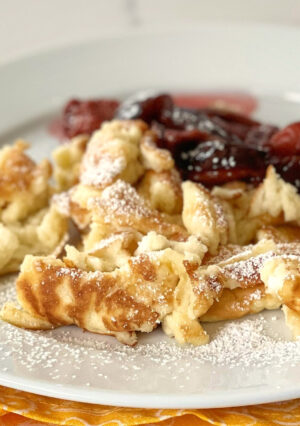 Kaiserschmarrn or Kaiserschmarren is an Austrian shredded pancake, It's a light and fluffy "pancake" with a souffle' texture, that is perfect for Brunch-- or even as a light evening meal. In Bavaria, it is often served with a plum compote. We also like ours lightly dusted with powdered sugar and with homemade apple sauce, on the side. Either way, it's easy to make and delicious!