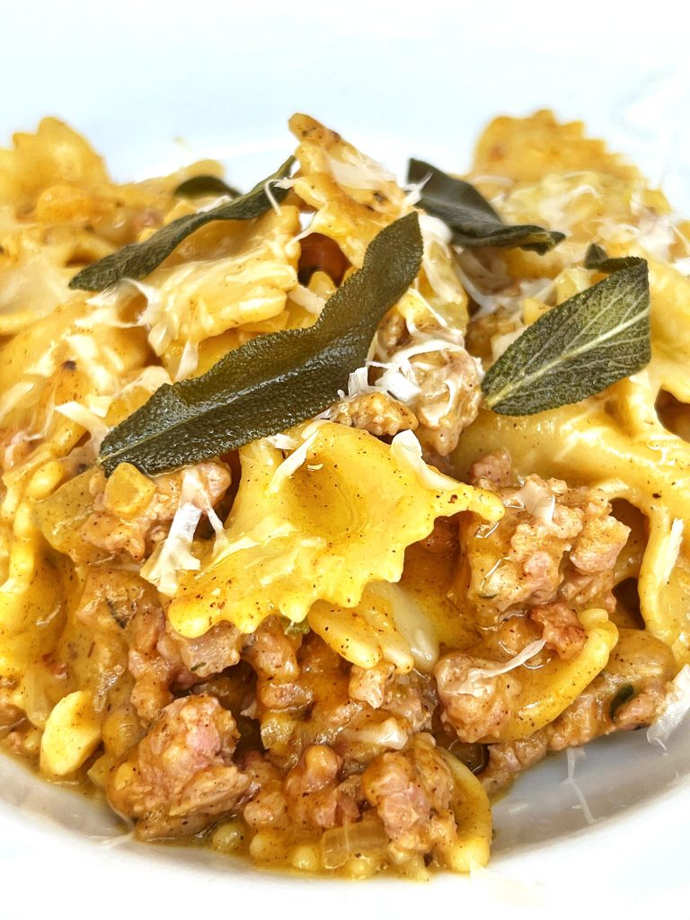 This pasta with a Pumpkin Cream sauce, sausage and sage is a comforting fall dish. Even if you claim you don't like pumpkin, this recipe could change your mind. The cream sauce is savory and unctuous. This recipe isn't  too complicated to make, so it's perfect for a busy dinner night meal.