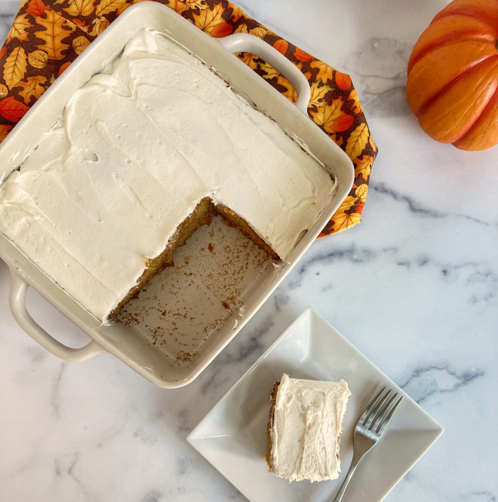 This Pumpkin Snack Cake is a perfect way to use leftover pumpkin. You can mix this by hand in a manner of minutes.  The cake is super moist, with warm fall spices.  I had leftover marshmallow creme, so I decided to (literally) whip up a buttercream frosting.  This is such a delicious fall flavored dessert I know you pumpkin lovers will enjoy.