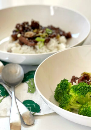 Mongolian Beef is a delicious Asian dish coated with a soy, ginger and garlic sauce. This recipe comes together faster than you can order Chinese take out. Served with rice, it's a flavorful meal that you can make at home.