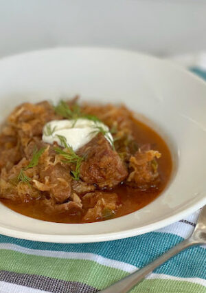 Transylvanian Goulash, aka Pork and Sauerkraut Stew is a delicious dish. The pork is oven-braised with vegetables and plenty of paprika for rich color and flavor. The pork is fork tender, and the sauerkraut is mild and lovely in this dish (believe me, I normally don't like sauerkraut). I served this atop creamy mashed potatoes for a hearty and comforting meal.