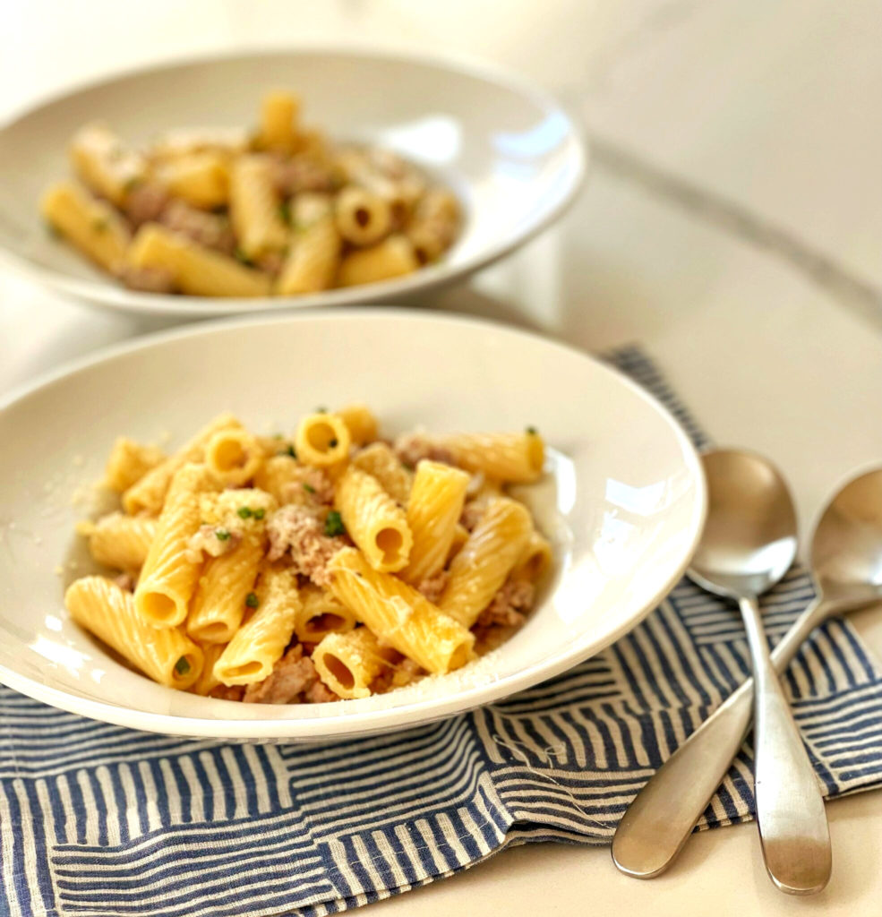 For a quick weeknight meal, this Rigatoni with pork sausage and chives is a comforting meal. The sauce is made with shallots, reduced white wine and heavy cream. Garnished with Parmesan cheese and chives, this dish is both filling and delicious.