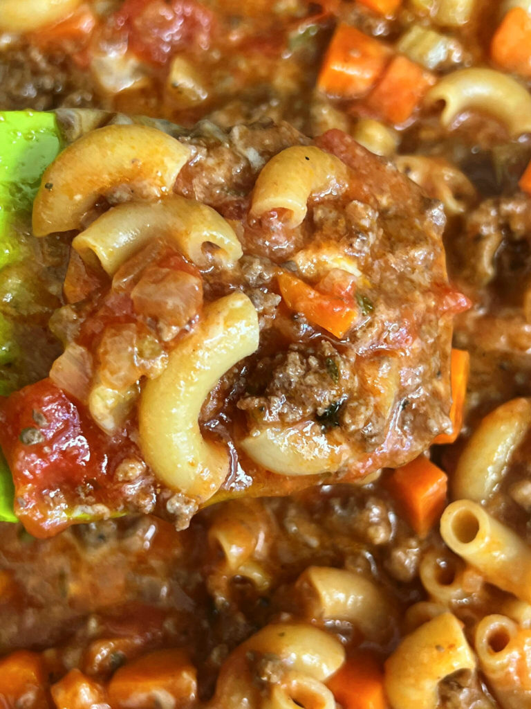 American Goulash is a classic fast and easy one dish wonder of cooked ground beef, vegetables, pasta and cheese. The beauty of this dish, is that this is all made in one skillet! American Goulash has no relationship to Hungarian Goulash. I want to clear the air on that, straight up!  This recipe is versatile,  where you can add vegetables and spices of your personal preferences.  American Goulash can be a perfect freezer meal that your family will love. 