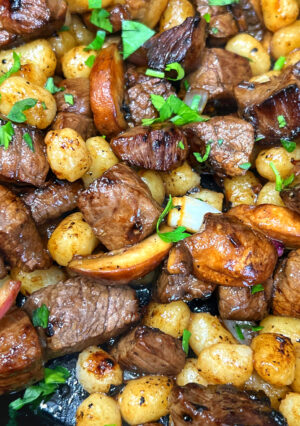 These delectable Balsamic Steak Bites with Gnocchi could be dubbed "Italian Steak and Potatoes". The steak is marinated in a balsamic vinegar comprised of soy sauce, Worcestershire, and a few other aromatics. Gnocchi is an Italian potato dumpling that you can easily find in a grocery store. (Otherwise, make your own if you have the time and skill!) Onion and mushrooms makes this a flavor packed dinner that you will love.
