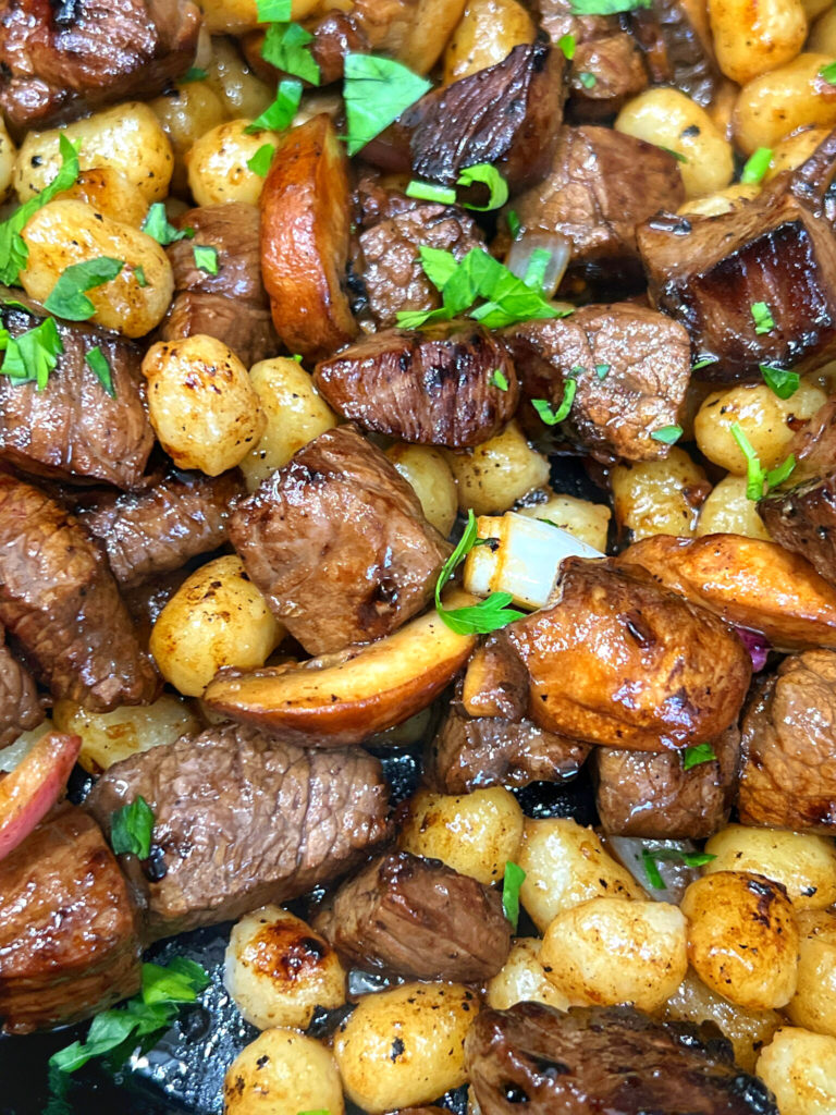 These delectable Balsamic Steak Bites with Gnocchi could be dubbed "Italian Steak and Potatoes". The steak is marinated in a balsamic vinegar comprised of soy sauce, Worcestershire, and a few other aromatics. Gnocchi is an Italian potato dumpling that you can easily find in a grocery store. (Otherwise, make your own if you have the time and skill!) Onion and mushrooms makes this a flavor packed dinner that you will love.