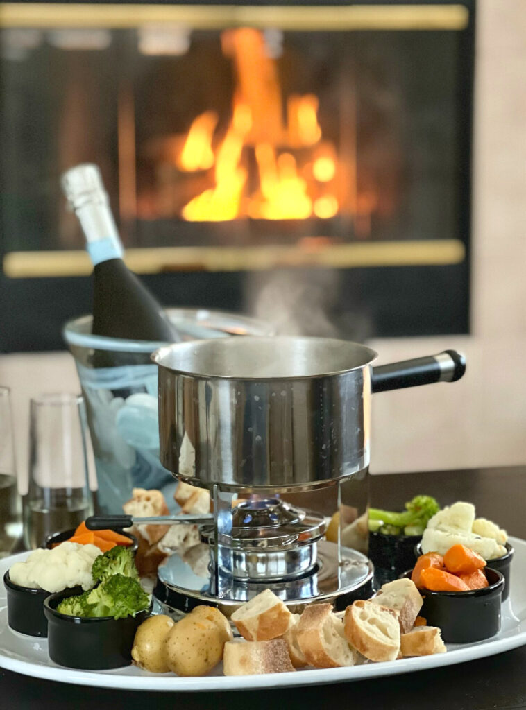 This Swiss Cheese Fondue Recipe is so easy to make. You don't even have to own a fondue pot! In a pot, you'll combine dry white wine and few other aromatics.  Gently melt Gruyere and Swiss Cheese until smooth.  I transfer the melted cheese mixture into my fondue pot, with a "sterno" to keep it warm.  Chunks of bread and "al dente" vegetables makes this a fun Fondue Party at home-- for a lot less cost than at a fancy restaurant.