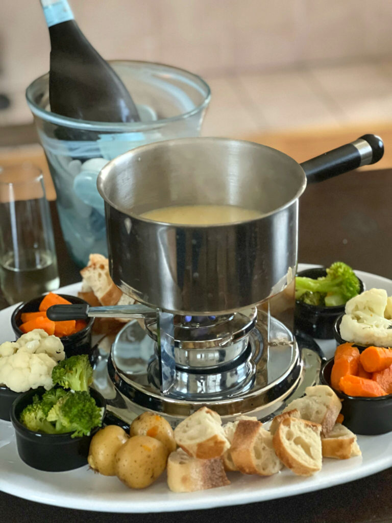 This Swiss Cheese Fondue Recipe is so easy to make. You don't even have to own a fondue pot! In a pot, you'll combine dry white wine and few other aromatics.  Gently melt Gruyere and Swiss Cheese until smooth.  I transfer the melted cheese mixture into my fondue pot, with a "sterno" to keep it warm.  Chunks of bread and "al dente" vegetables makes this a fun Fondue Party at home-- for a lot less cost than at a fancy restaurant.