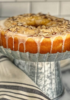 Almond Pound Cake with a glaze and sliced almonds