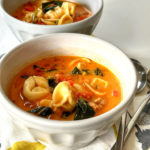 You won't believe how easy this delicious Creamy Tortellini Soup with Sausage and Spinach recipe is to make! The soup is in a creamy tomato broth, with sausage and spinach. It's so hearty and comforting, too!