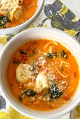 You won't believe how easy this delicious Creamy Tortellini Soup with Sausage and Spinach recipe is to make! The soup is in a creamy tomato broth, with sausage and spinach. It's so hearty and comforting, too!