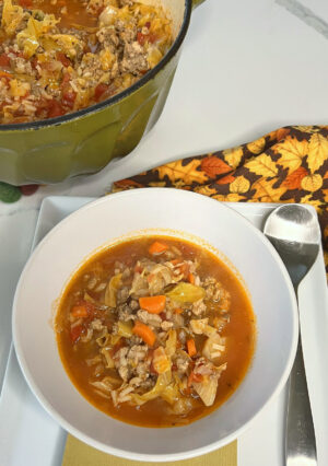 A bowl of stuffed cabbage soup.
