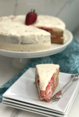 This Strawberry Shortcake Cake is made with an easy homemade sponge cake. Crushed and slightly sweetened fresh strawberries is the filling and cake is frosted with a creamy and dreamy cream cheese frosting! This is one of my favorite summer pot luck desserts that will please a crowd.