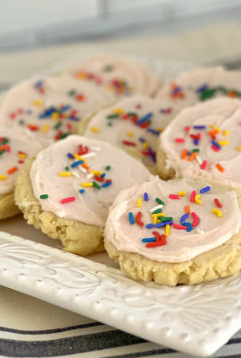 Swig Soft Sugar Cookies became famous at the Utah Swig Soda Shops. They are a thick, soft sugar with a sweet and creamy sour cream frosting. The cookies have rough edges that are slightly crisp. They cookies have a buttery taste, are very soft and the luscious frosting is perfection.