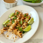 Chicken satay is a popular Southeast Asian dish that consists of marinated, skewered, and grilled chicken, typically served with a flavorful peanut sauce. The chicken marinade is really flavorful as is the peanut sauce. Both are quite easy to make. The skewers can be a fun appetizer or a full meal, served with sticky rice.