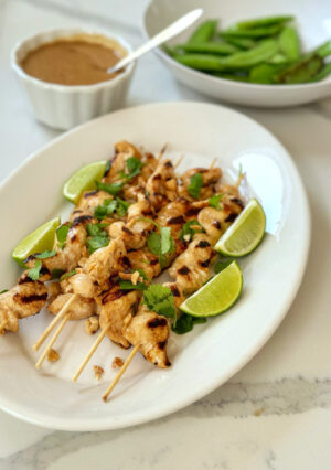 Chicken satay is a popular Southeast Asian dish that consists of marinated, skewered, and grilled chicken, typically served with a flavorful peanut sauce. The chicken marinade is really flavorful as is the peanut sauce. Both are quite easy to make. The skewers can be a fun appetizer or a full meal, served with sticky rice.