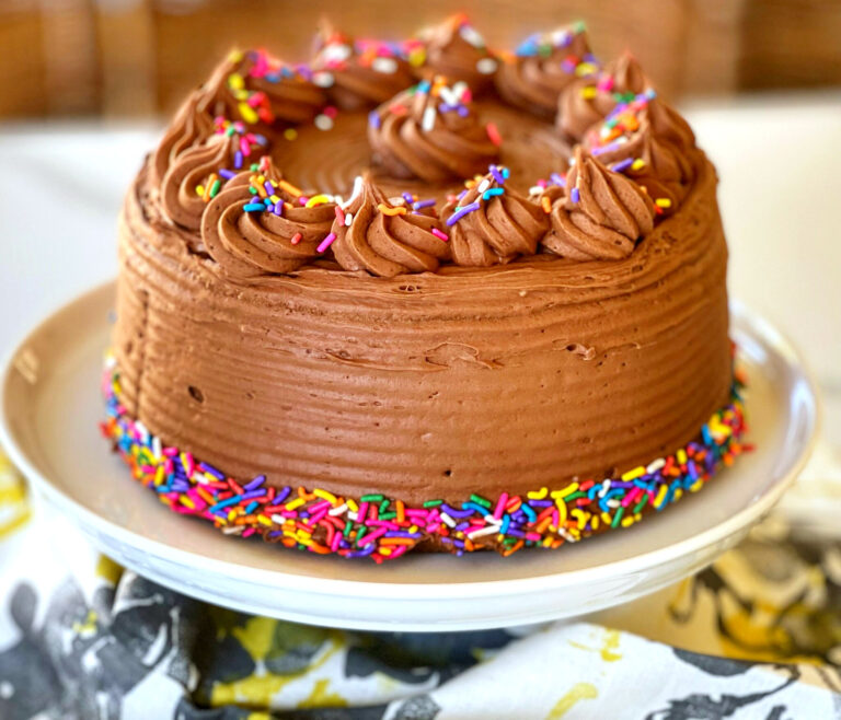 Yellow Cake with a Luscious Chocolate Frosting makes a perfect birthday cake. This recipe doesn't come from a box, either! This classic cake is everything you'd want to celebrate your birthday-- or for any occasion. It's perfect in every way-- tender, moist and delicious. The frosting is chocolate, silky with a surprise ingredient that really amps up the chocolate flavor.