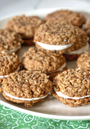 These Oatmeal Cream Pies have a creamy marshmallow filling that is irresistible. These remind me of Little Debbie Oatmeal Creme Pies. Best of all, you can bake them, fresh, at home. They are so good!