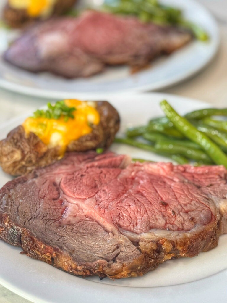 A lice of medium rare prime rib beef,